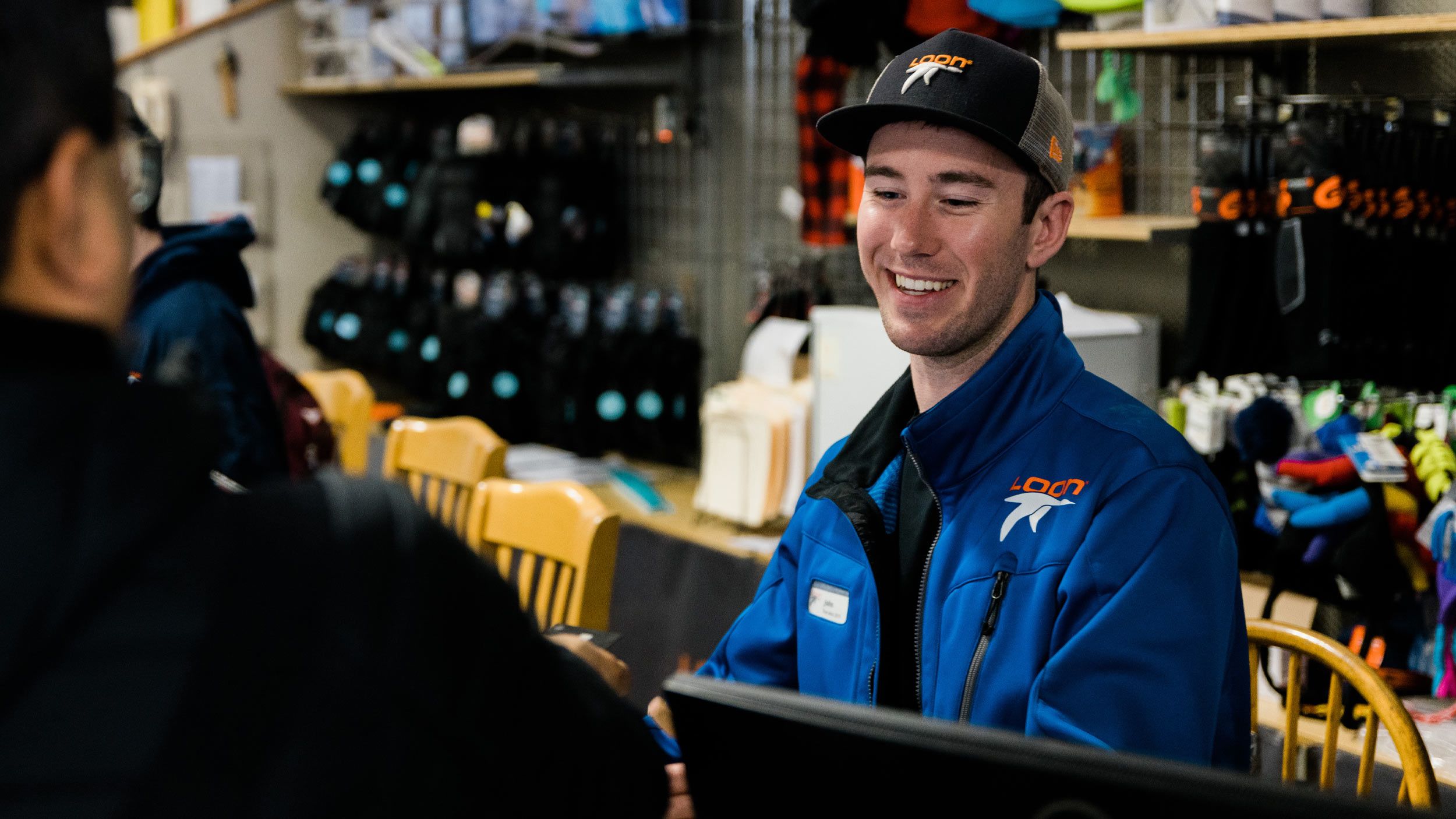 Guest Service agent helping a guest.