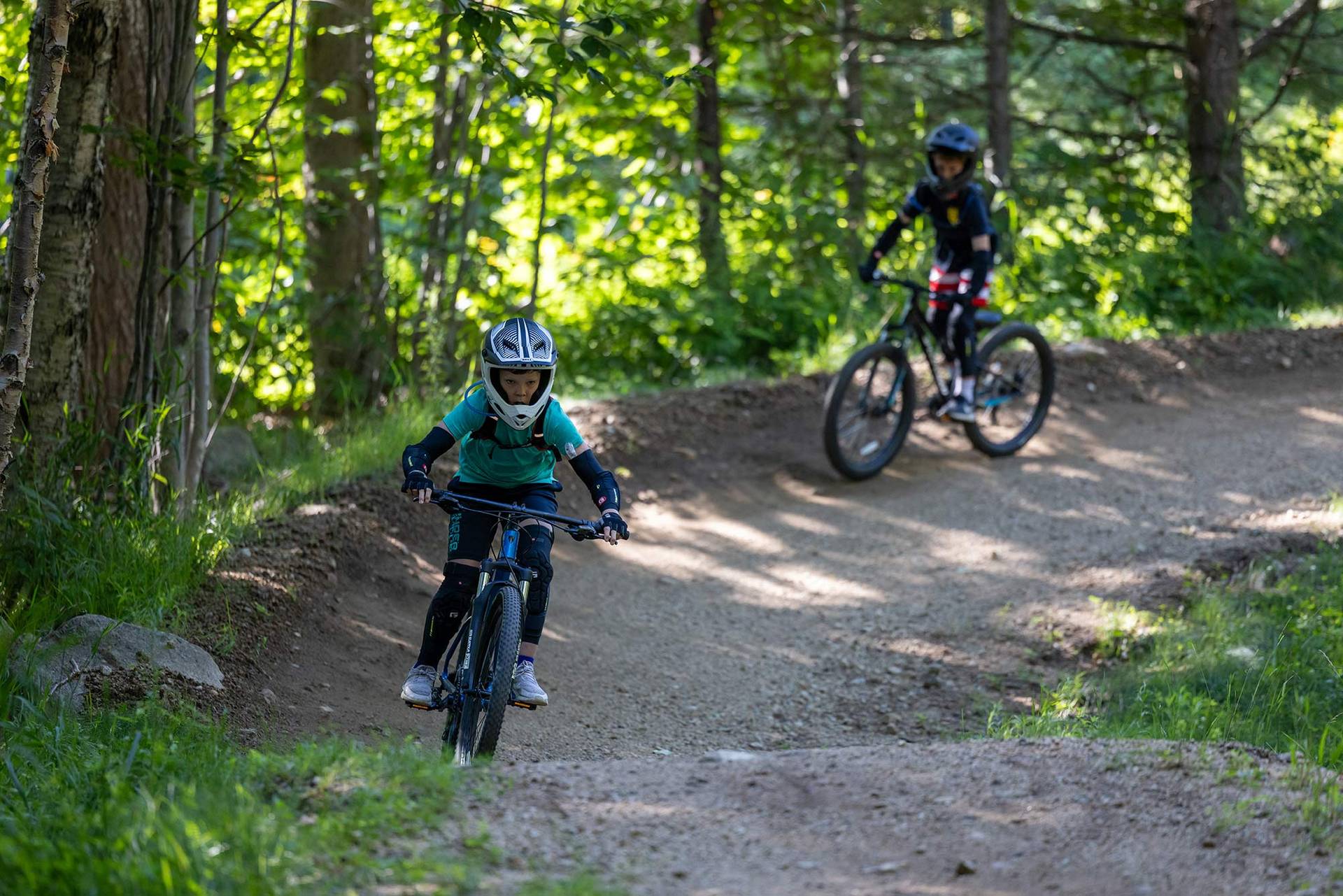 two campers riding a downhill trail at Loon Bike Park