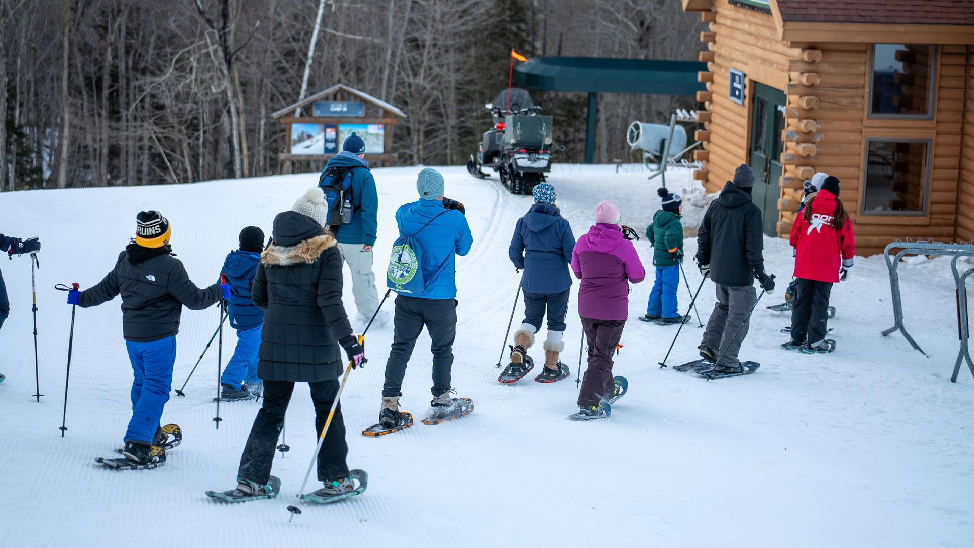 two girls toasting marshmallows at Snowshoe & S'mores