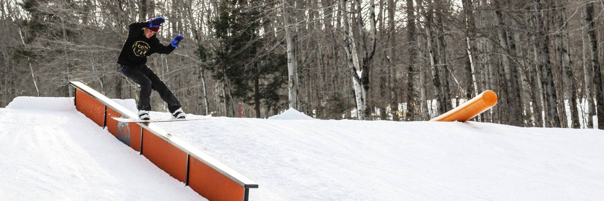 snowboarder riding a flat rail