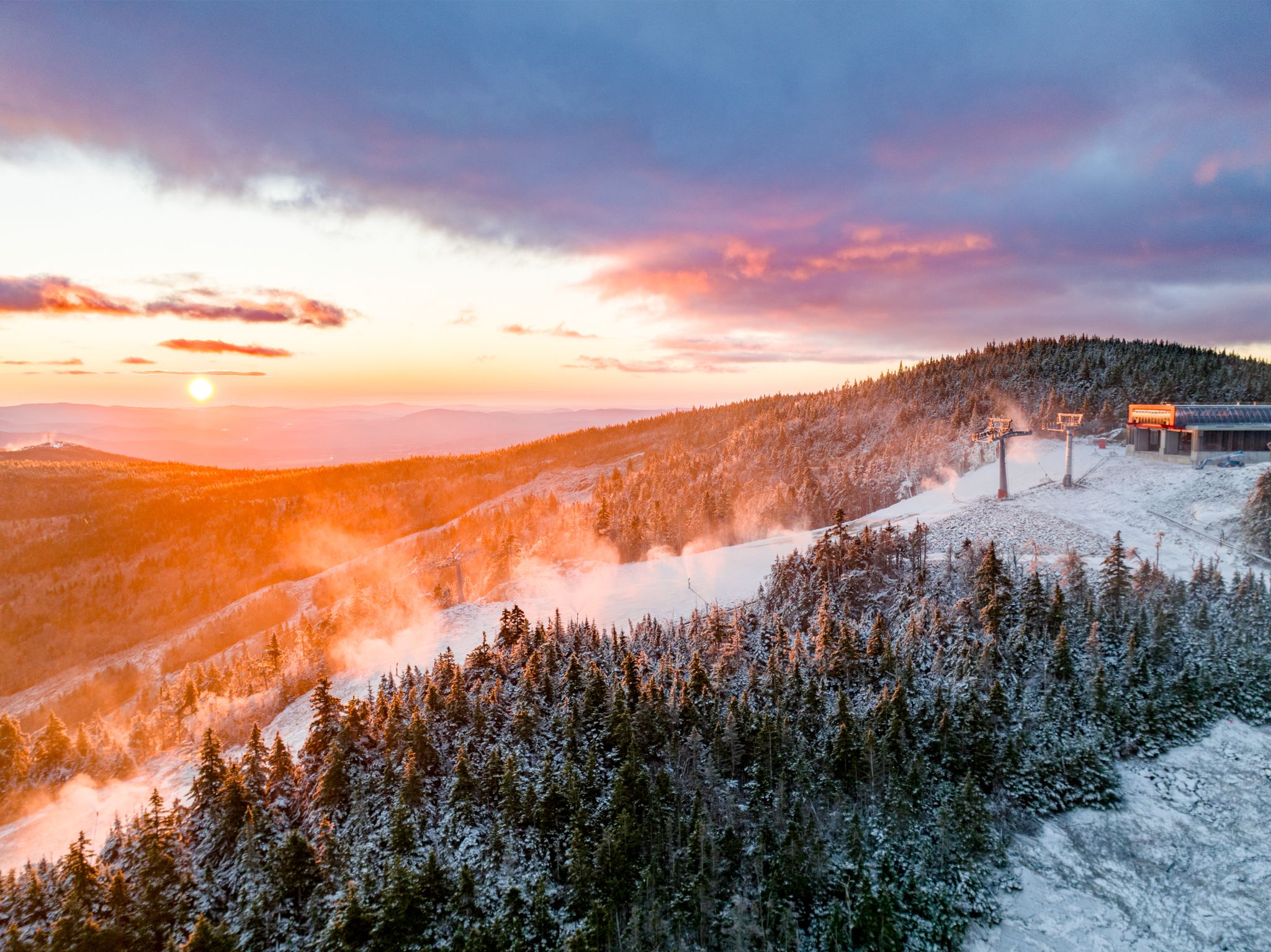 Snowmaking at Sunday River as the sun rises.