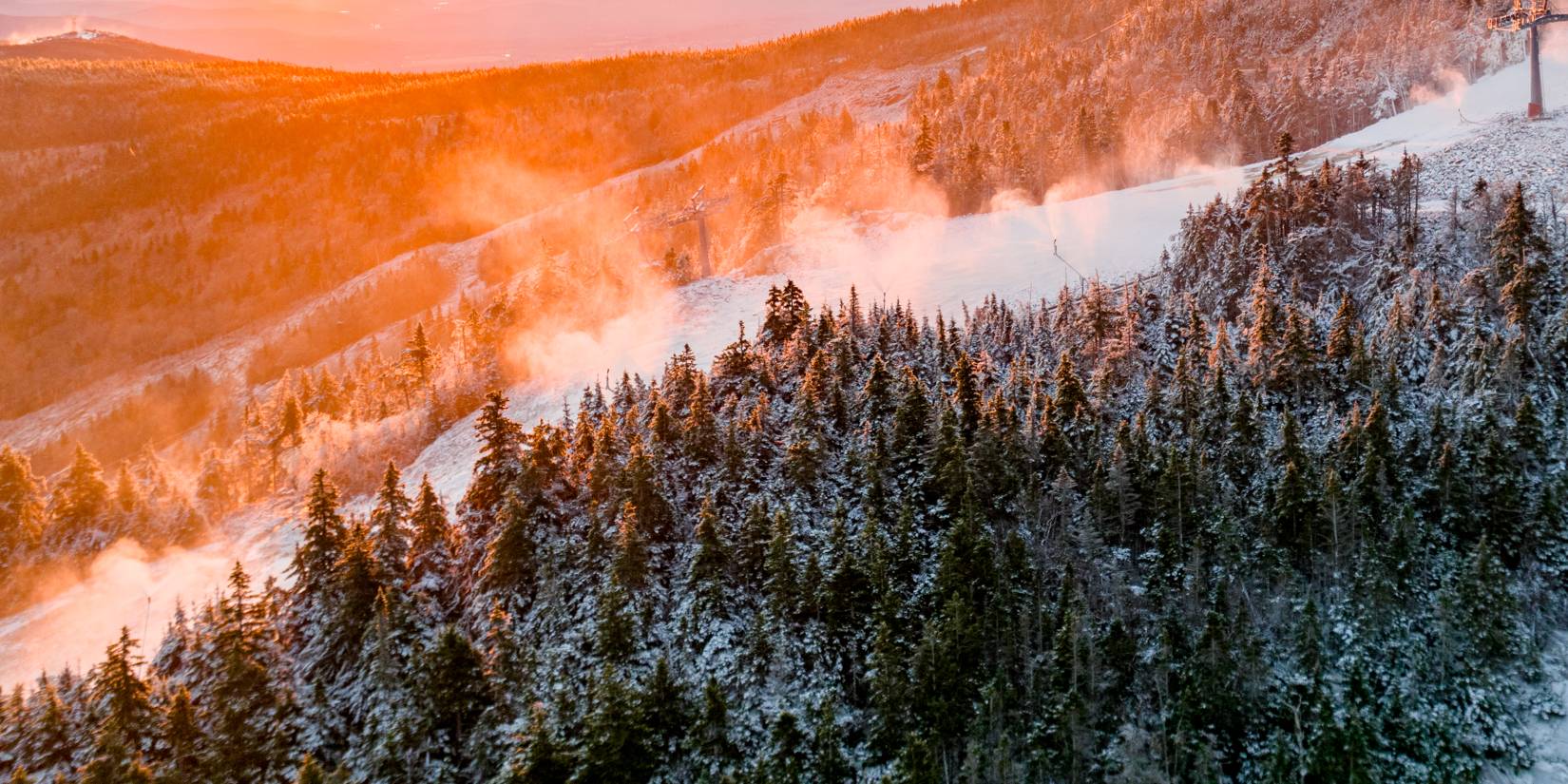 Snowmaking at Sunday River as the sun rises.