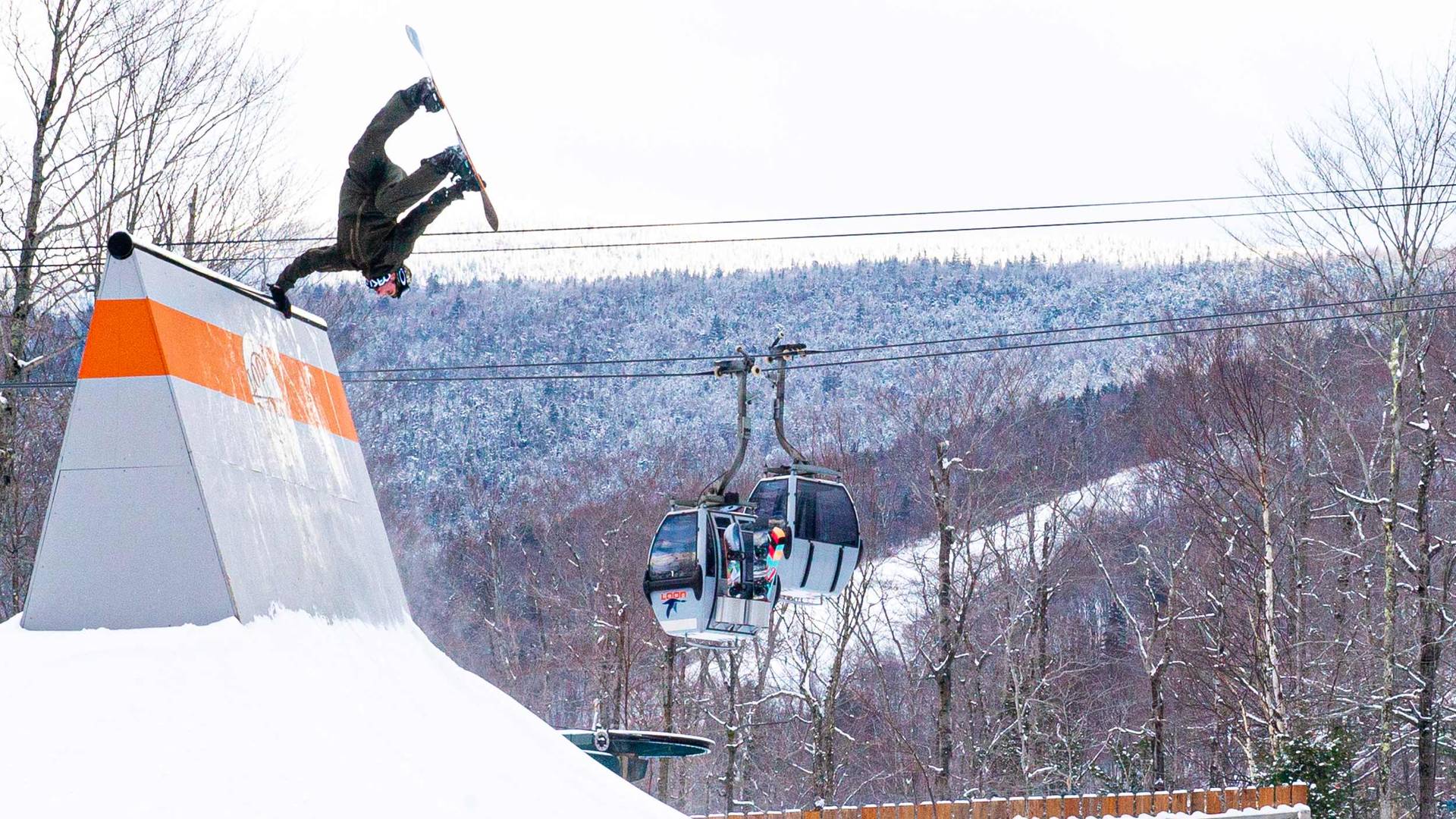 Snowboarder hits a feature at Loon Parks