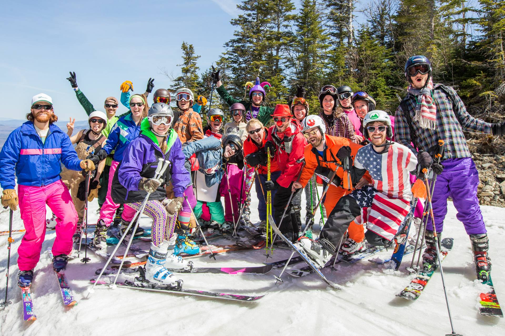 Group of skiers and snowboarders dressed in fun outfits at Sugarloaf.