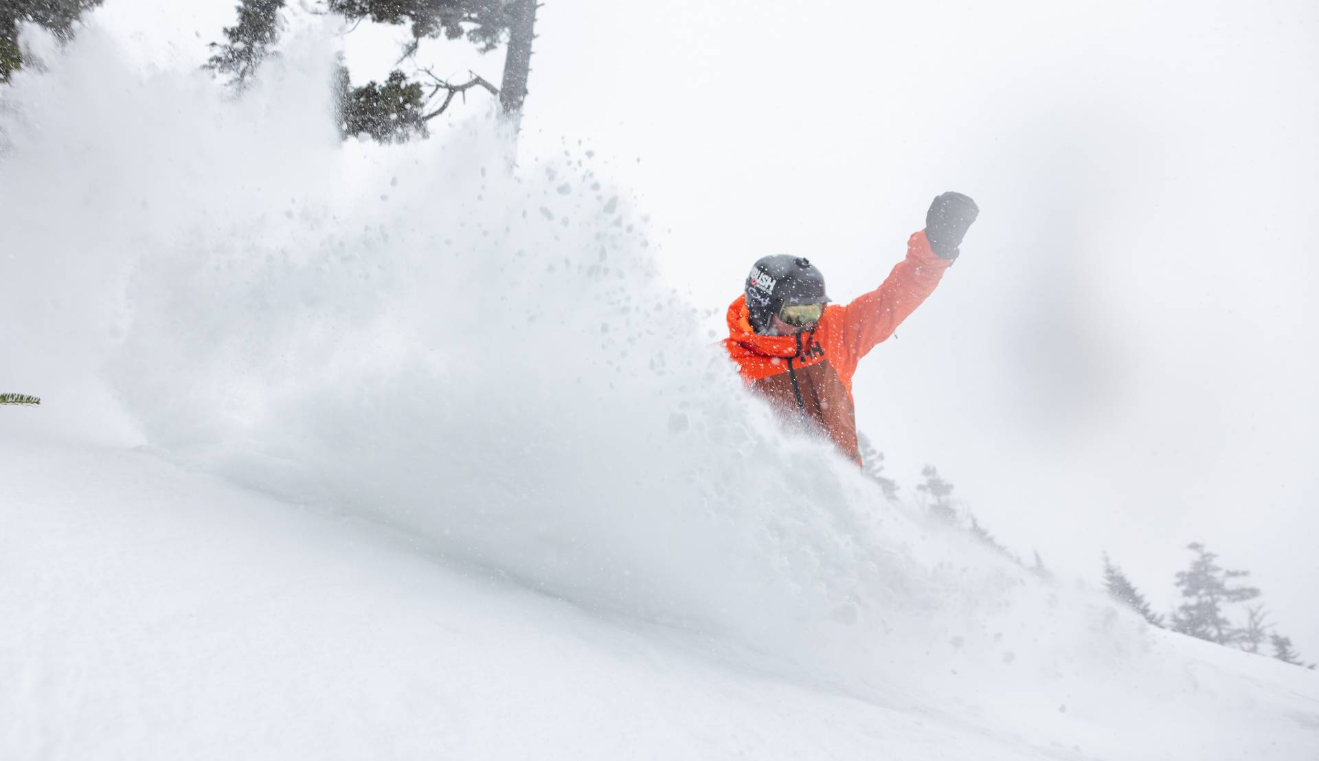 Snowboarder carving on fresh corduroy at Sunday River.