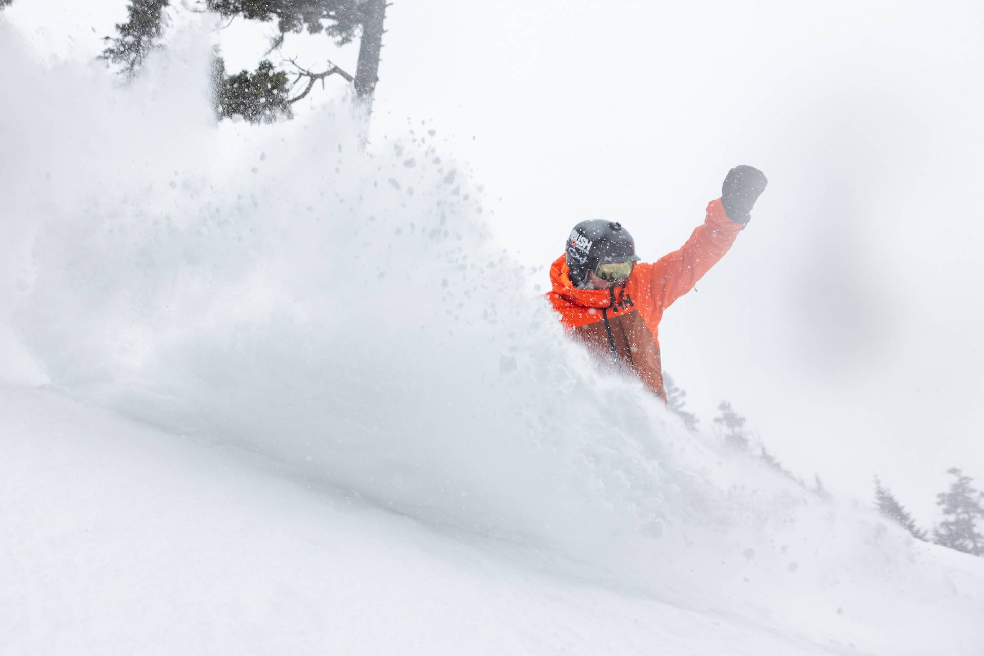 Snowboarder carving on fresh corduroy at Sunday River.