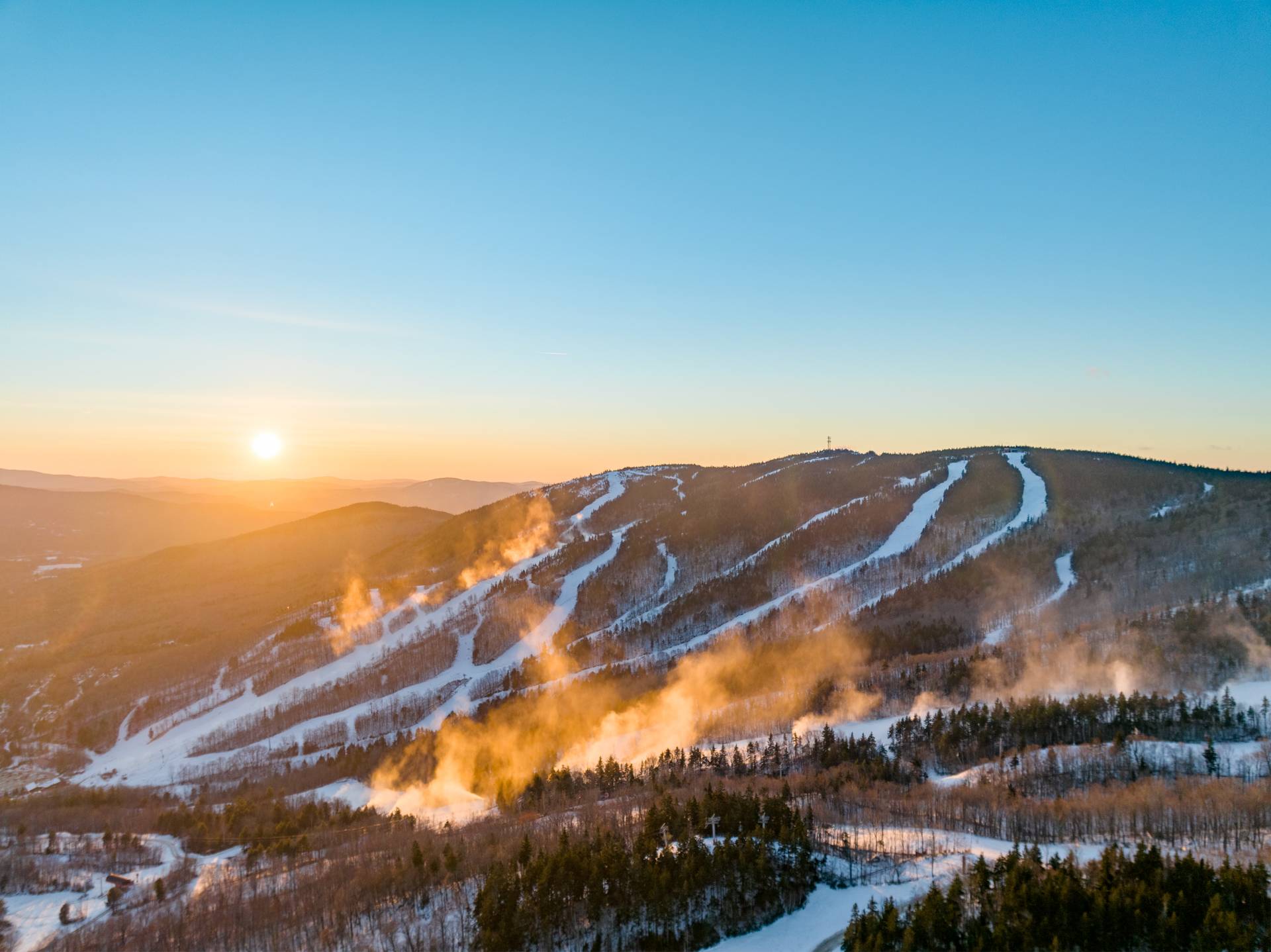 Snowmaking at Sunday River under the sunrise