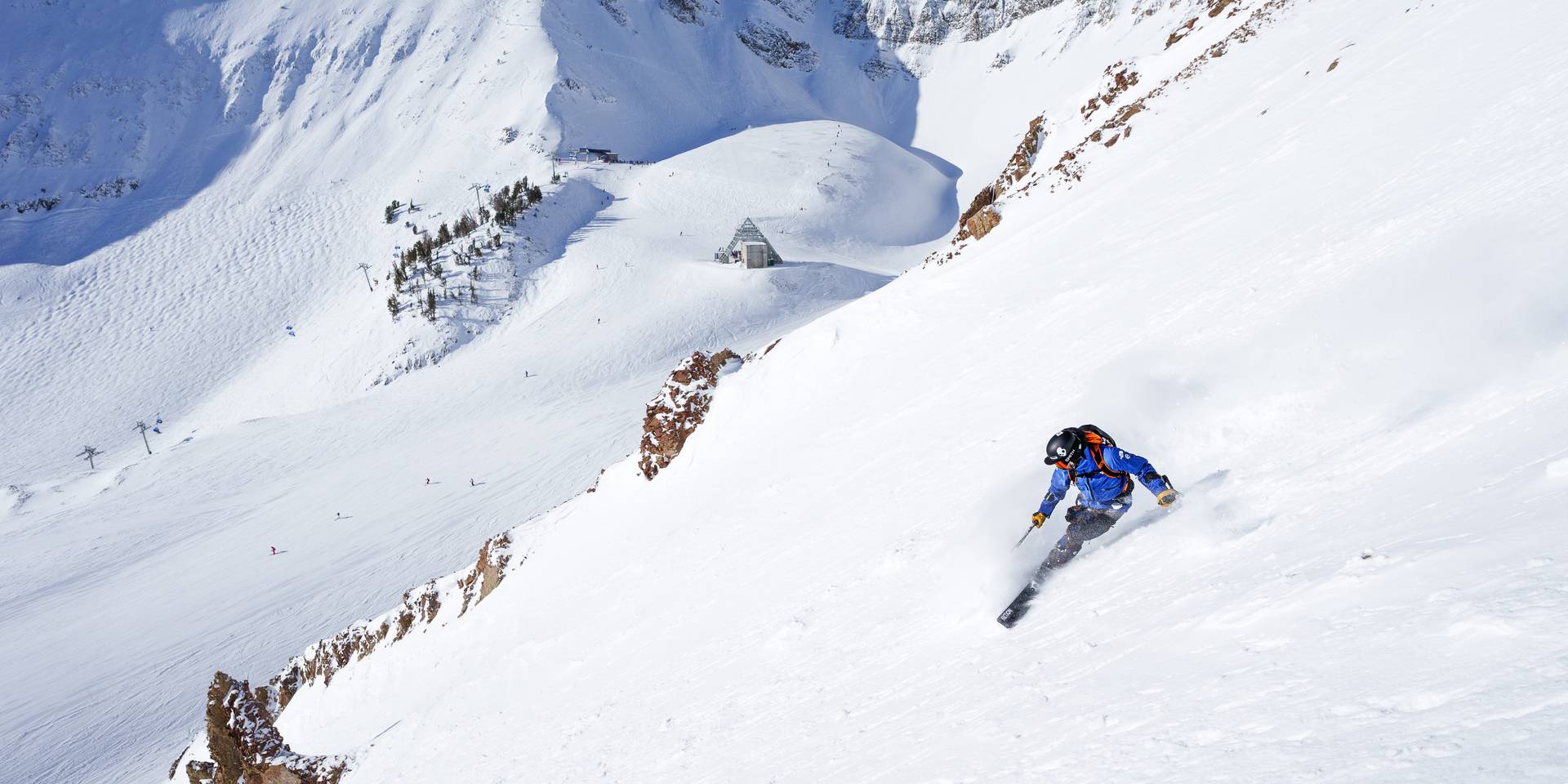 skier coming down a chute a Big Sky, Montana