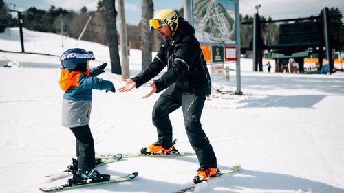 Little boy in lesson with an instructor