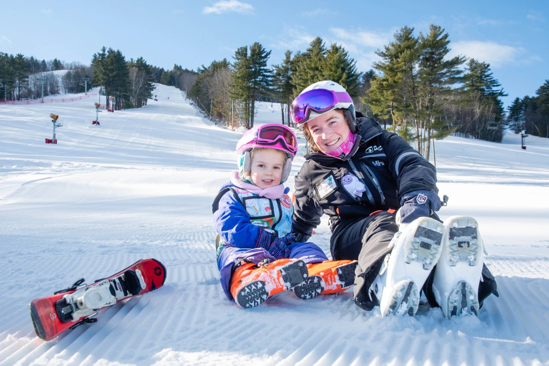 Little Girls and instructor smile.