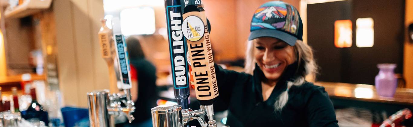 Lift operator gives high-five to guest loading chair lift