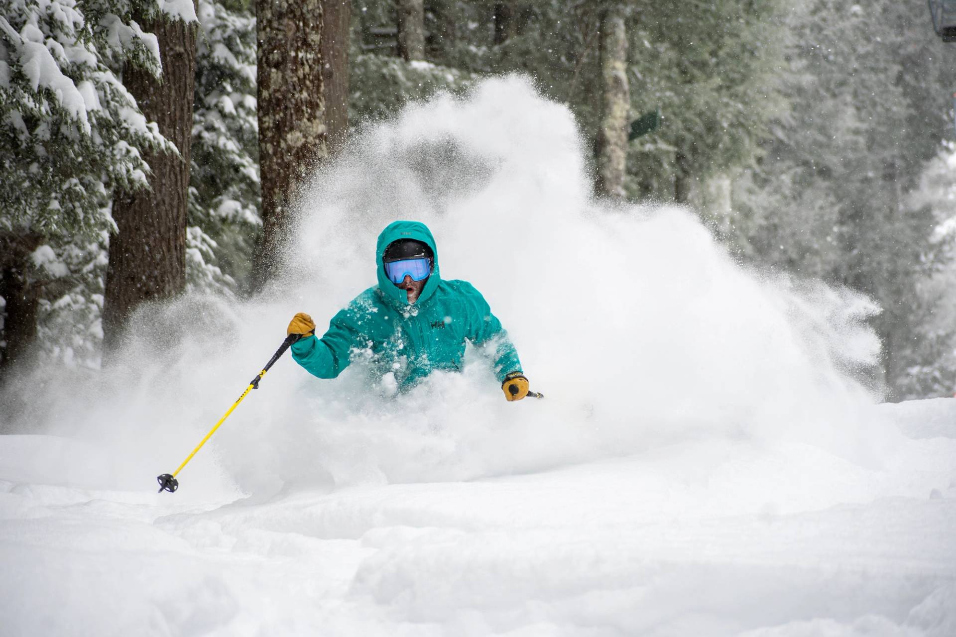 Skier going through deep powder