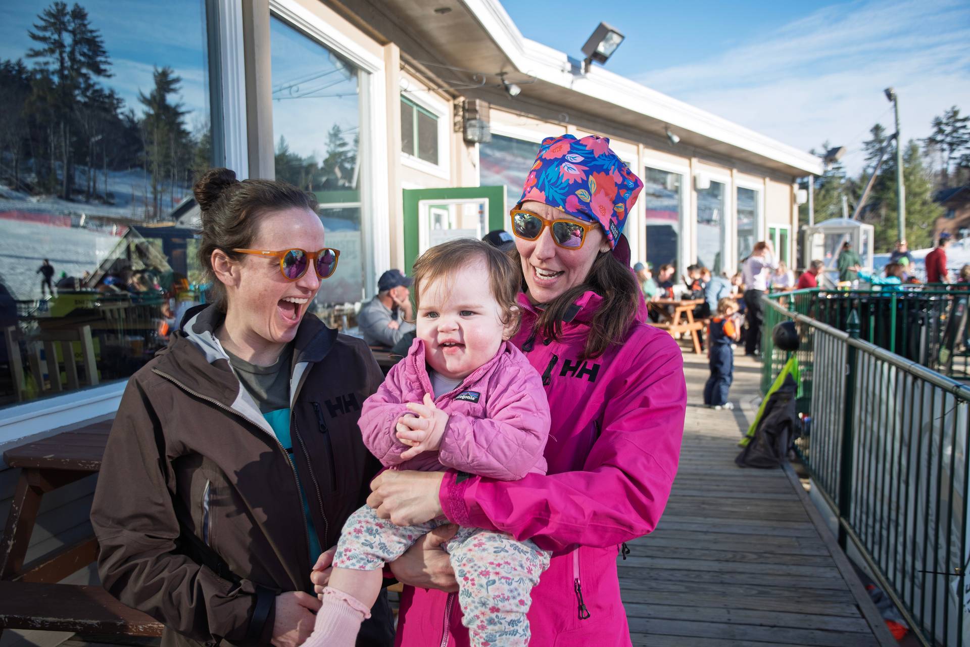 Baby and ladies on the deck sun