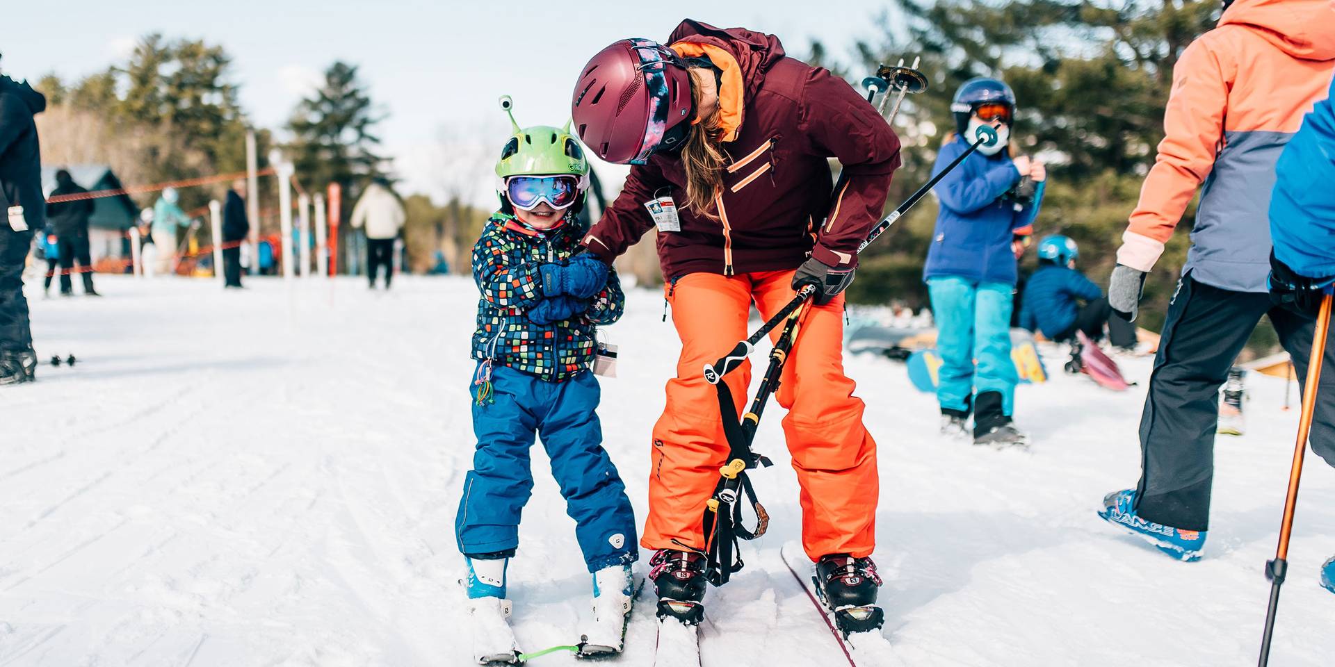 Mum encourages yound child in Beginner area