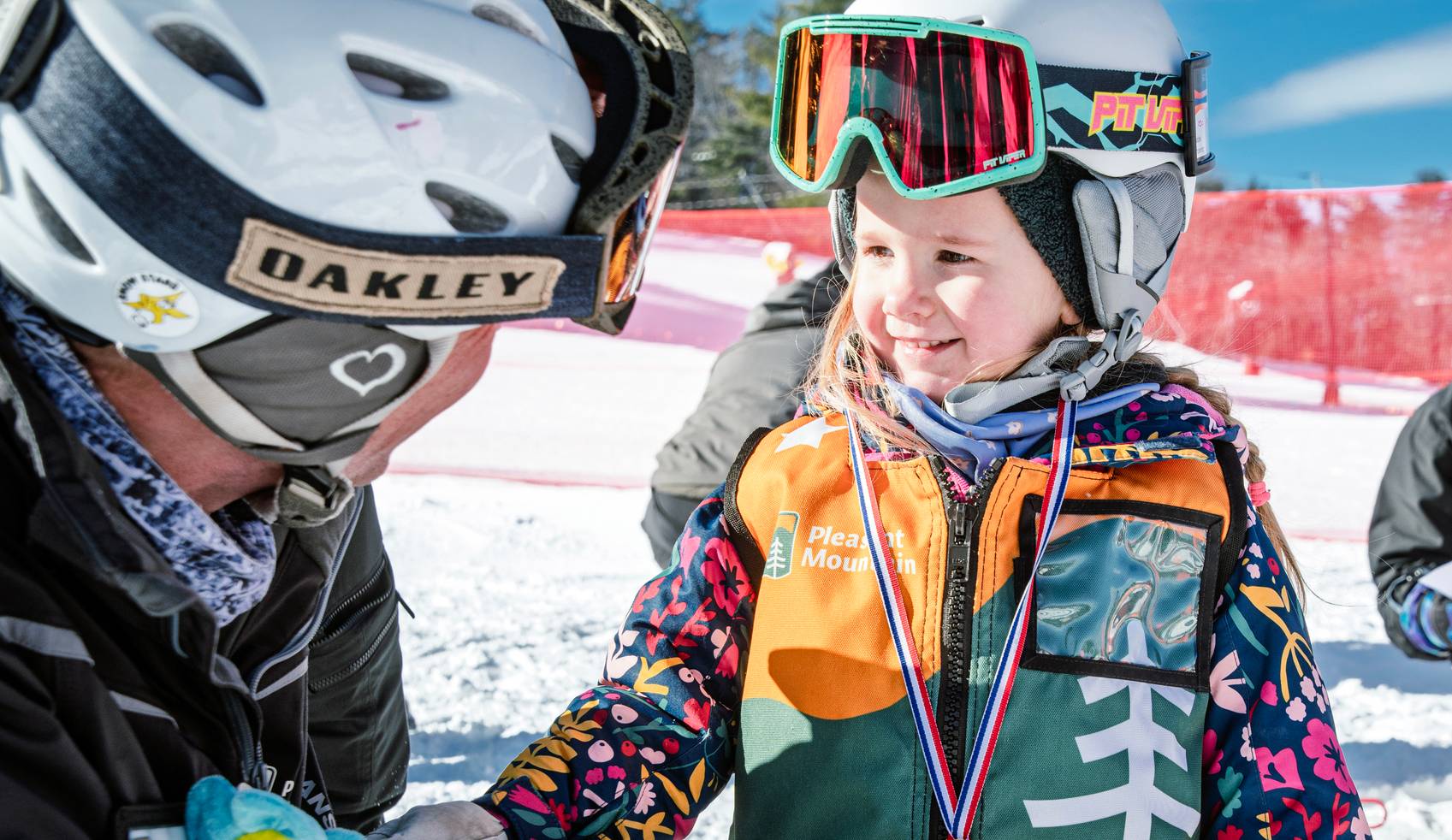 Sweet little girl smiles at instructor