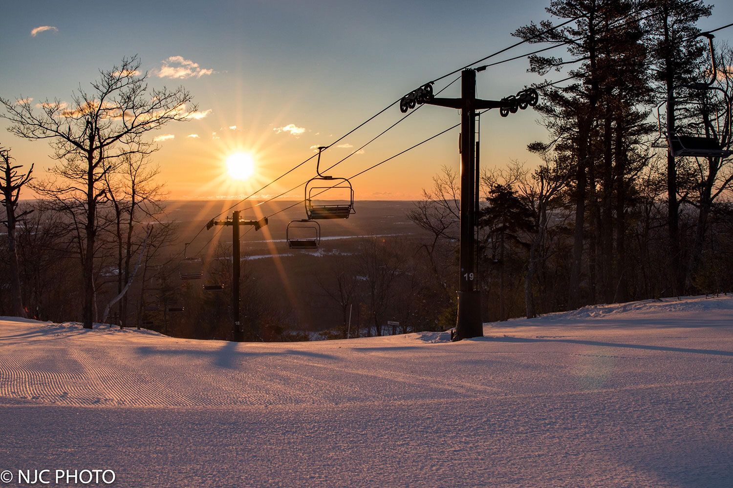 Sunrise at the summit of Pleasant Mountain ski resort.