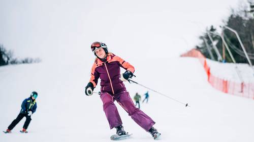 Happy Lady skiing on the headwall