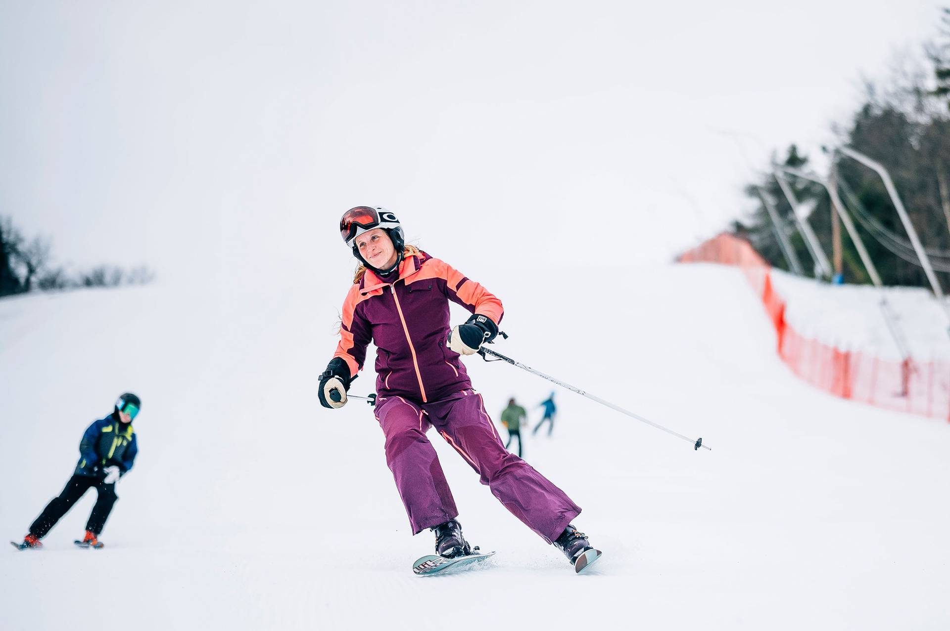 Happy Lady skiing on the headwall