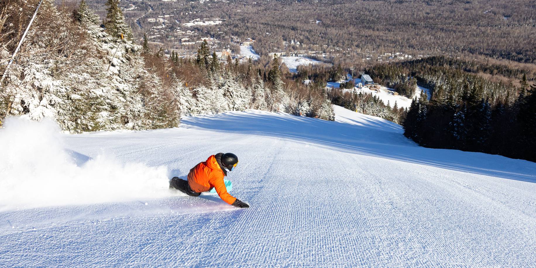 Snowboarder carving on the legendary Widowmaker trail at Sugarloaf