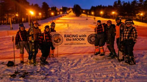 Race team dressed up in costume ready to race with the moon