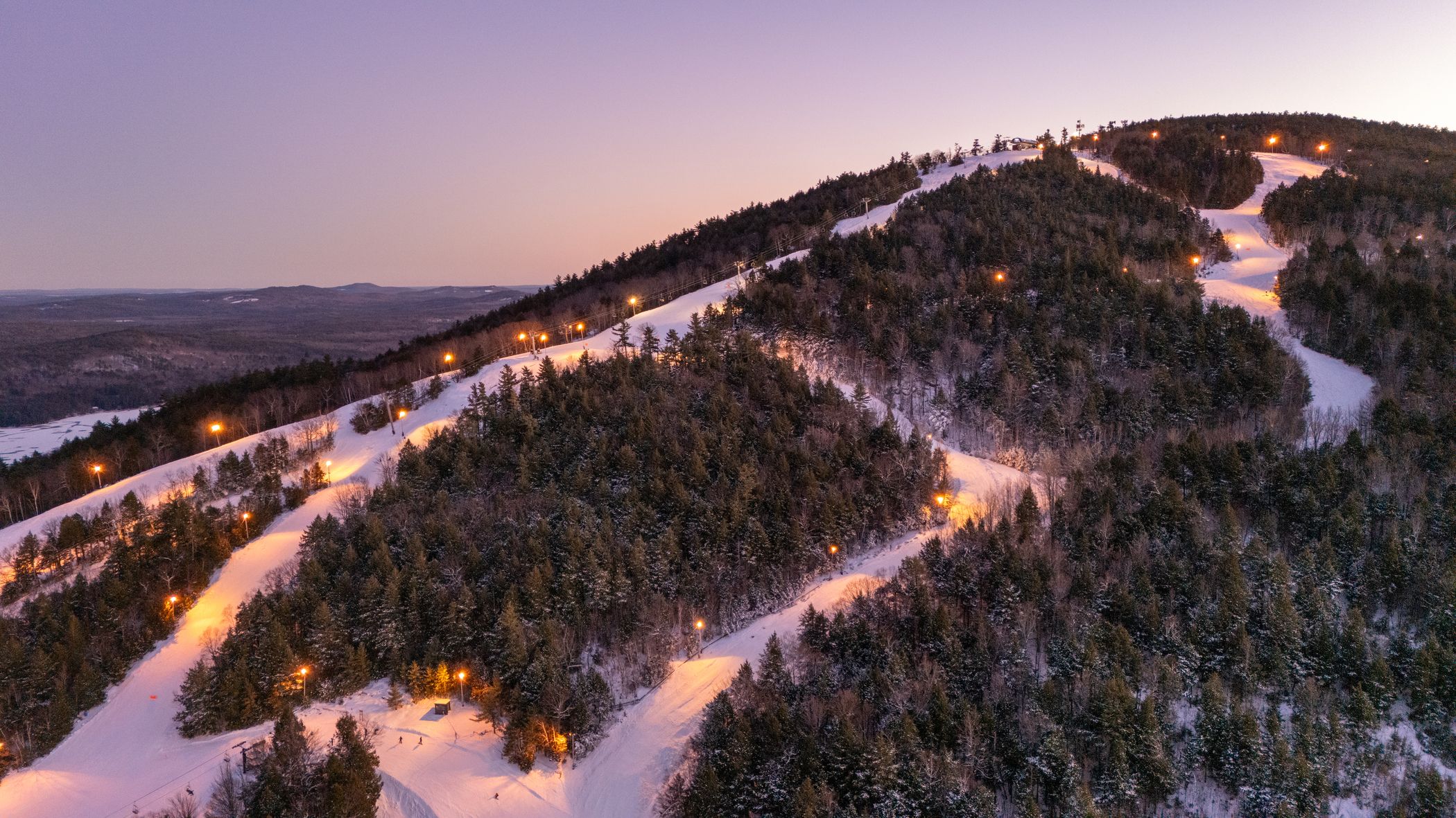 Pleasant Mountain with lights on at twilight