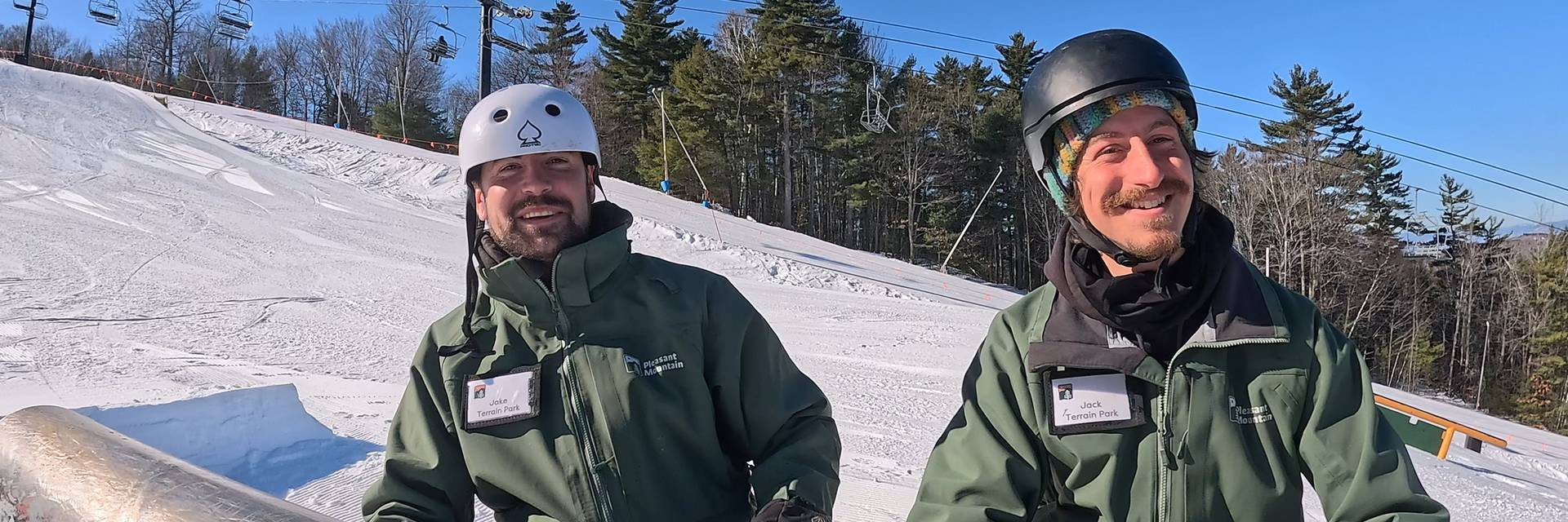 Terrain Park Managers sit on the barrel