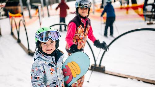 Little girls heading out on the hill