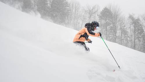 Josh skis in powder