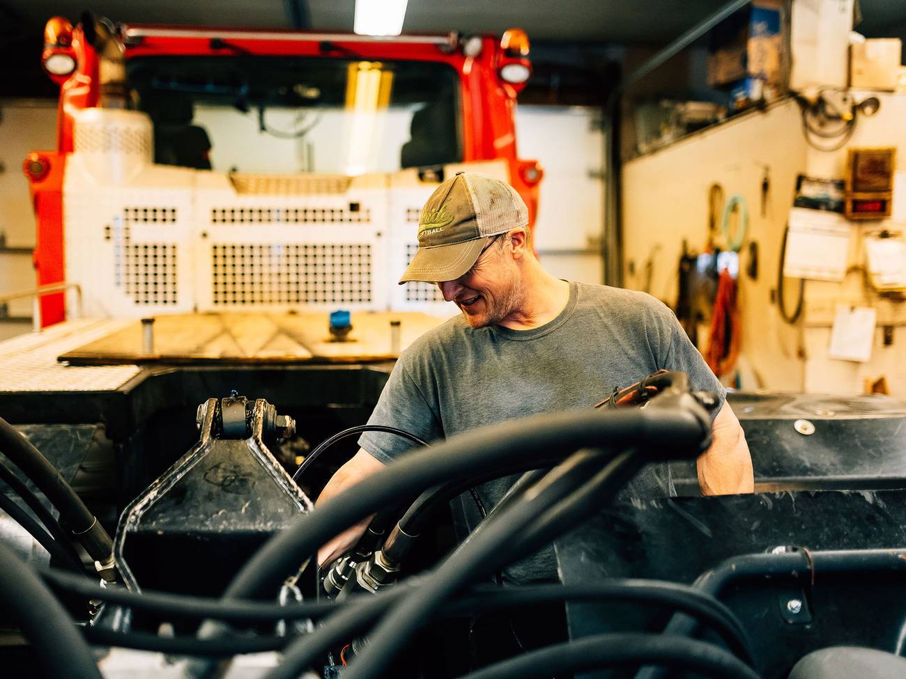 Driver adjust equipment behind groomer in shop