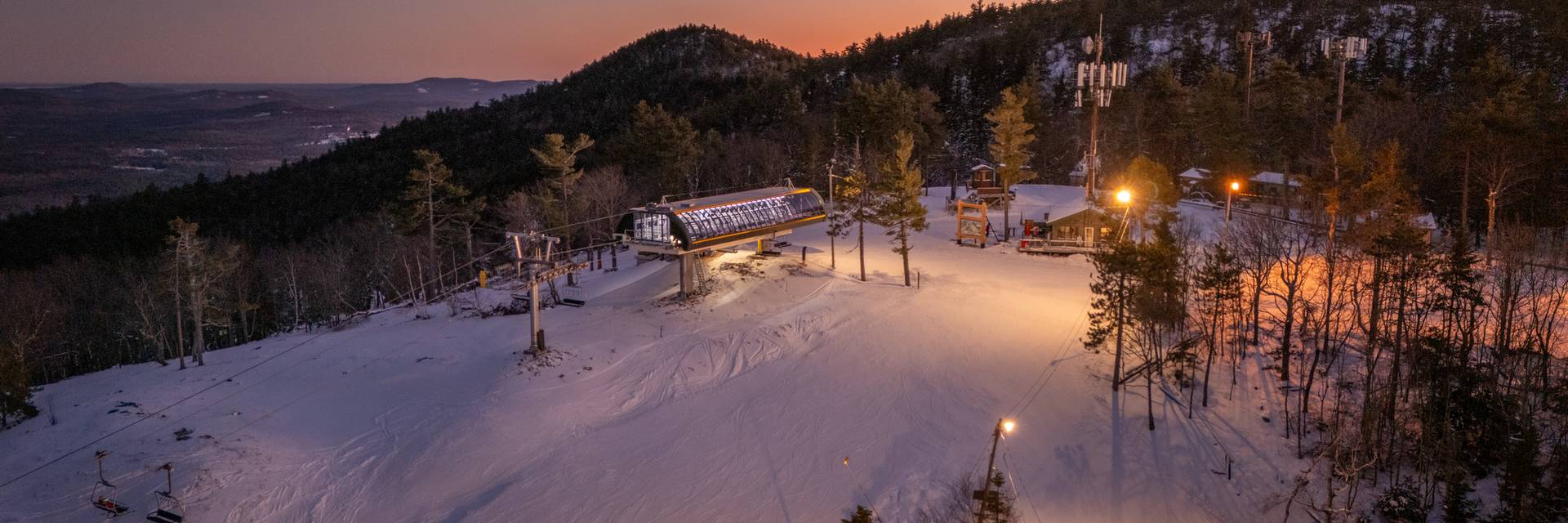 Mist over lake and mountain at sunrise