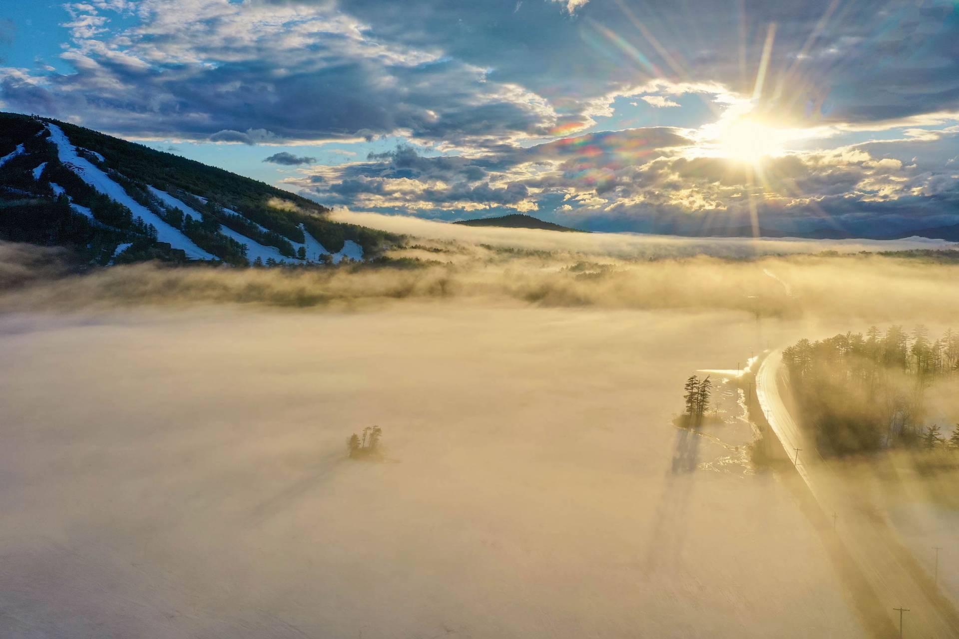 Mist covers Moose Pond with Pleasant Moutainin the background