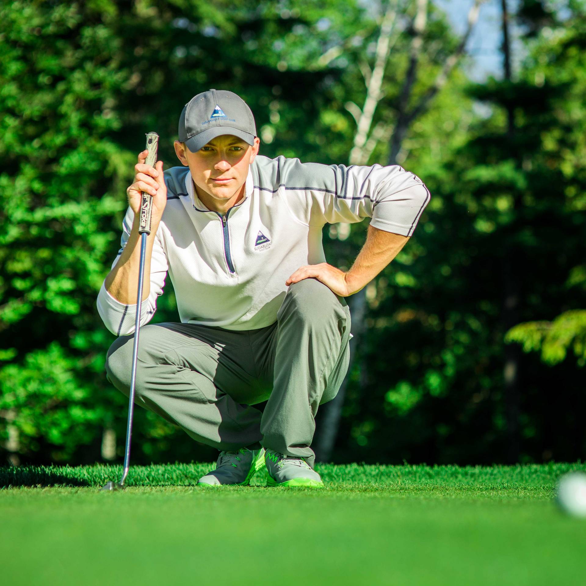 Golfer looking at ball
