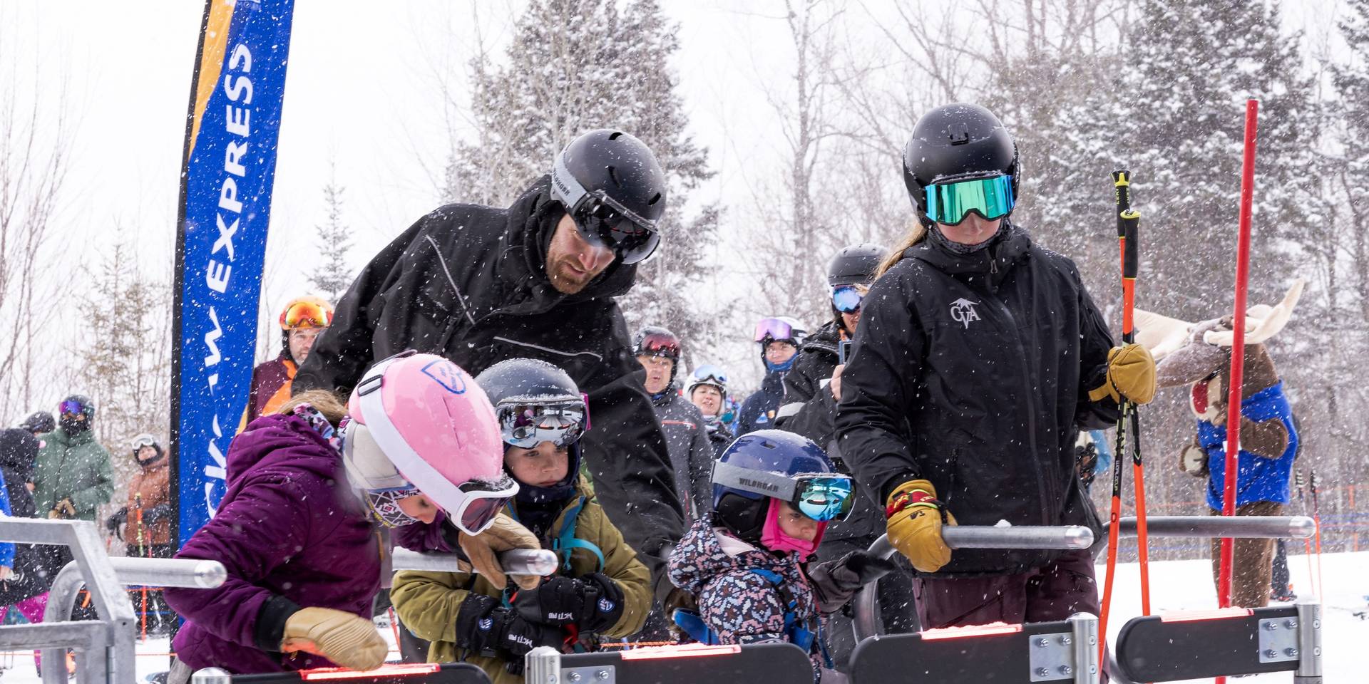 Young skiers at lift gate