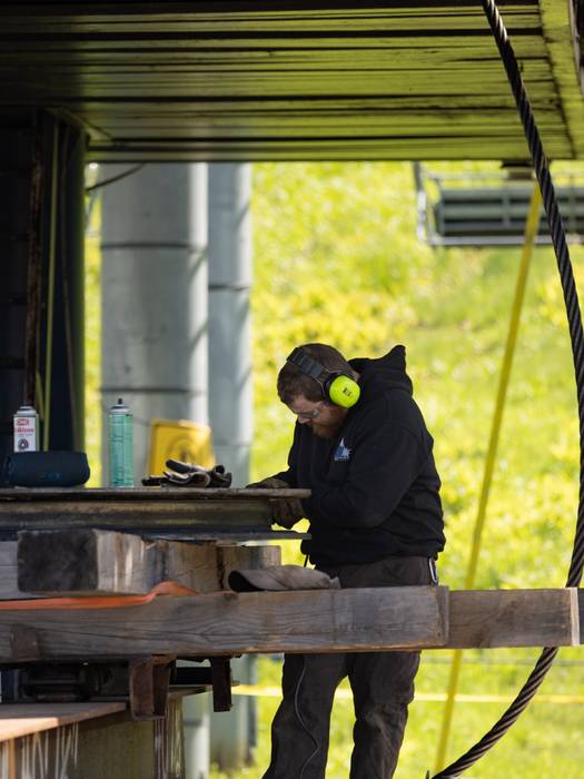 Team member working on lift