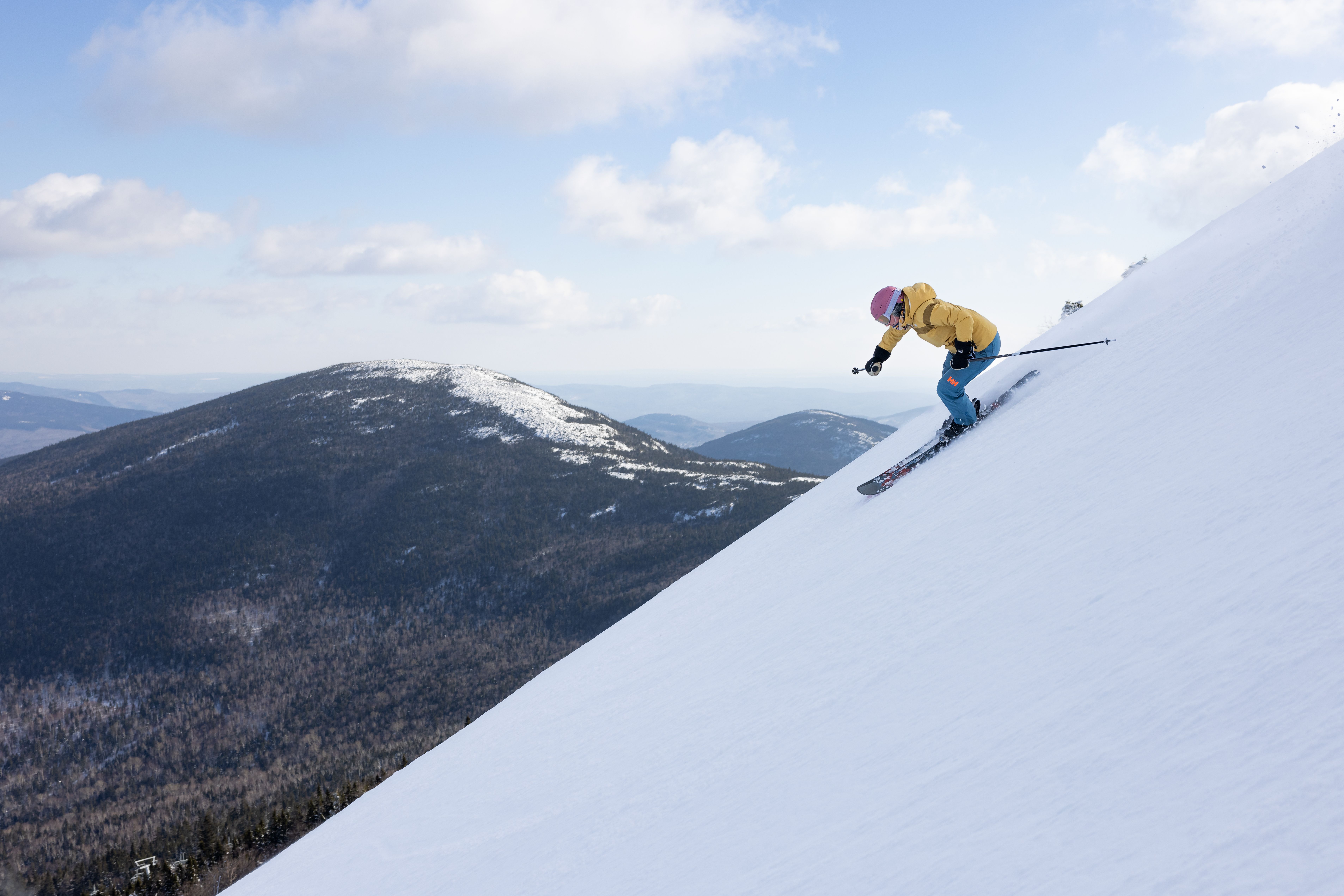 skier on steep terrain