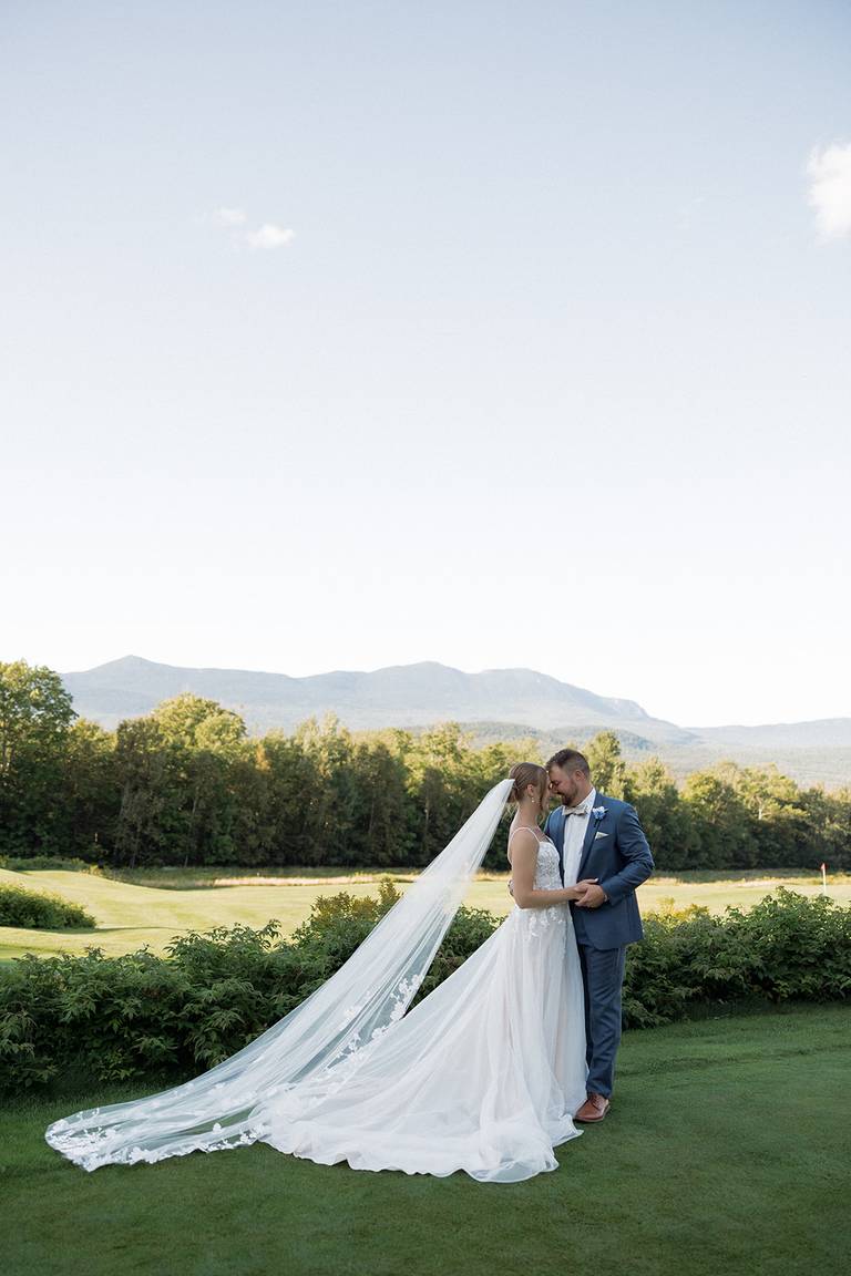 bride and groom on golf course view