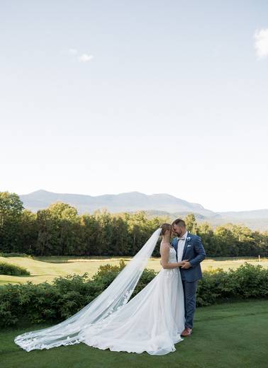 bride and groom on golf course view