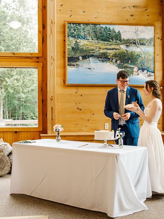 Couple cutting cake