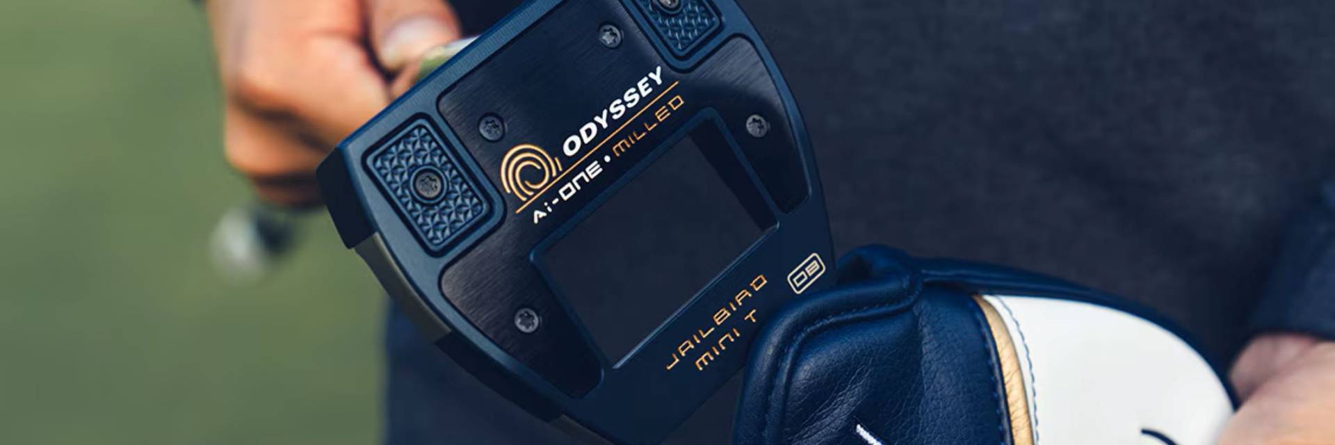 Golfer holding Odyssey clubs