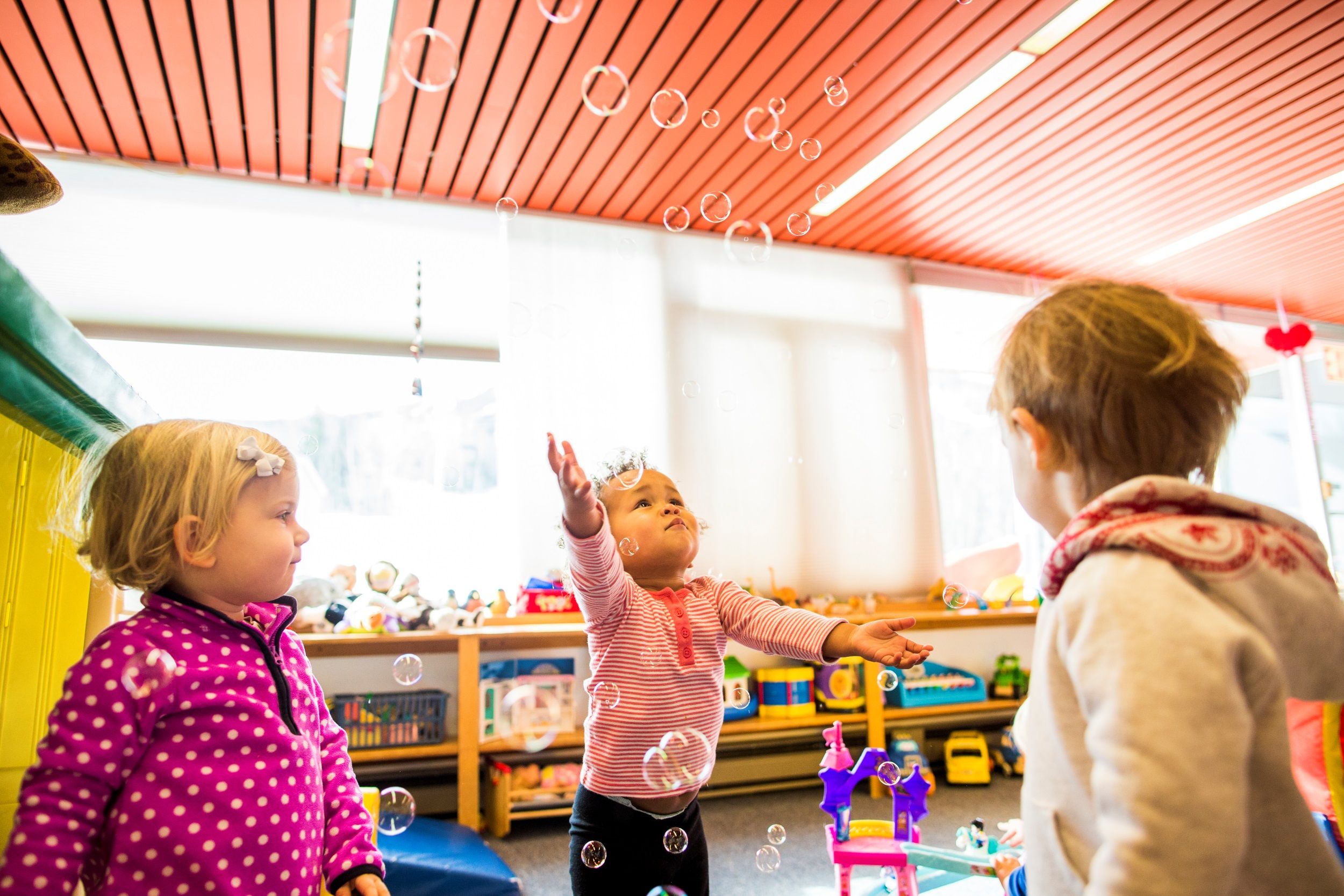 Children playing with bubbles