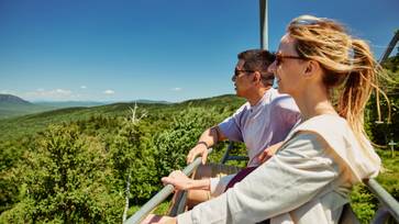 Two scenic lift ride participants