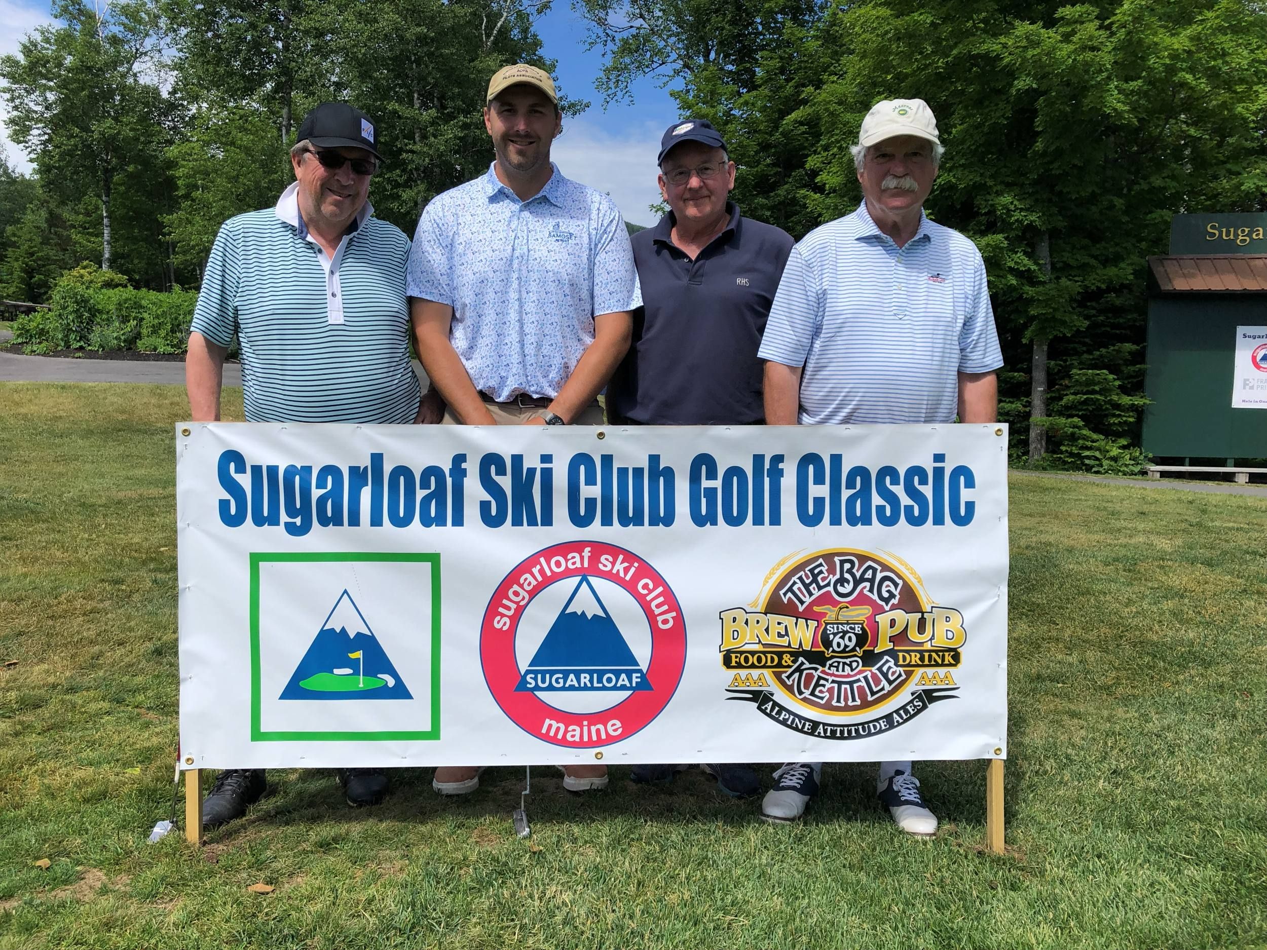 Participants holding sign
