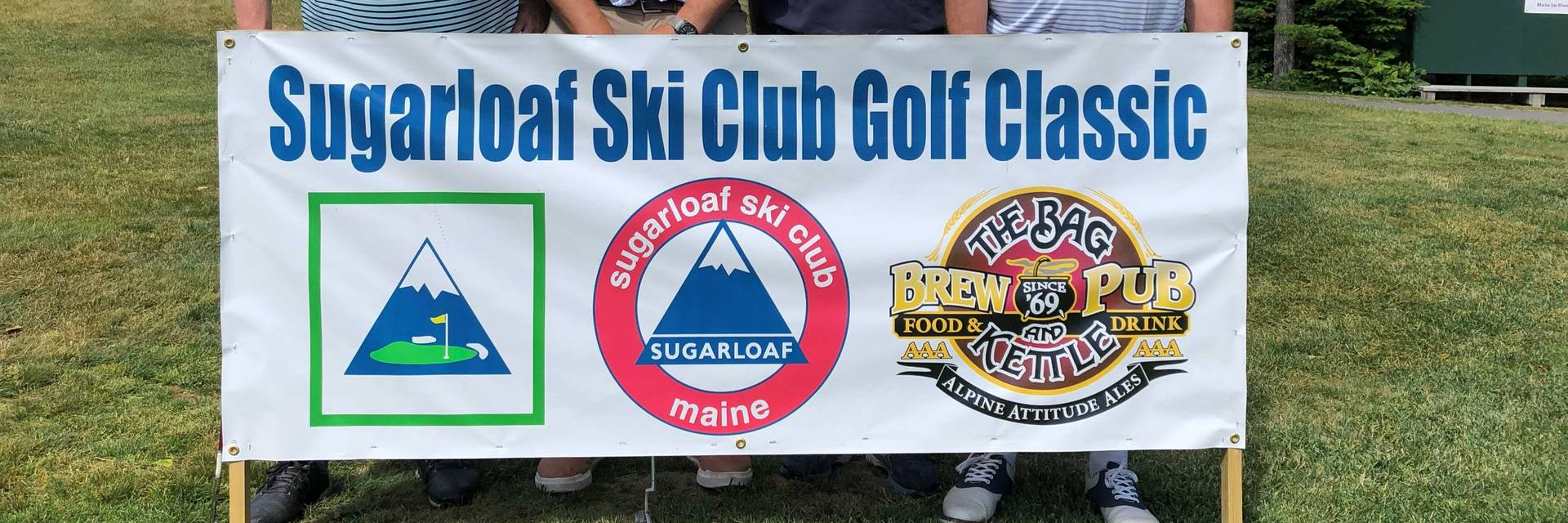 Participants holding sign