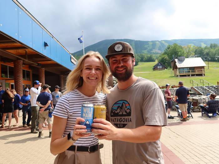 Couple with beer smiling