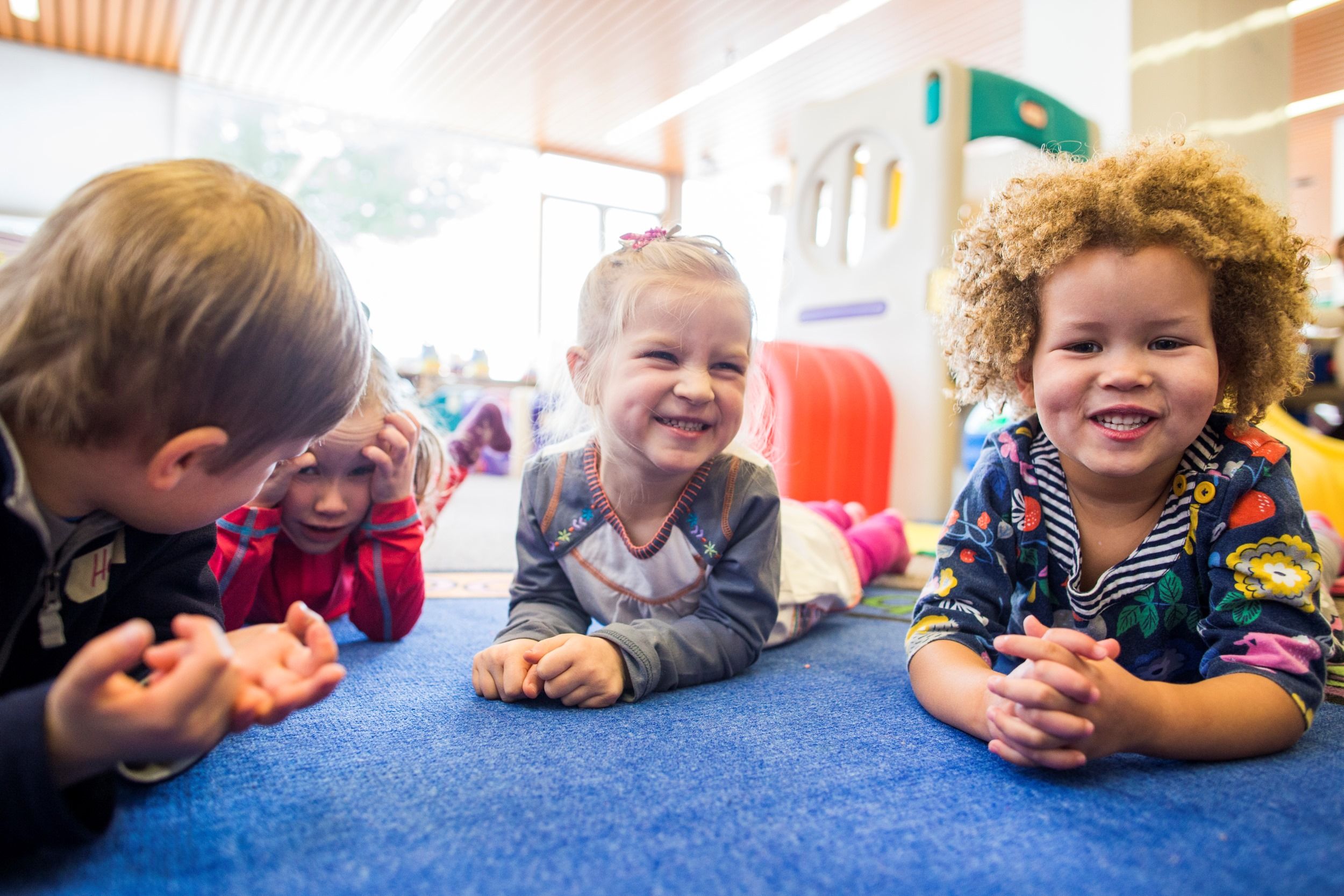 Four young children playing together 