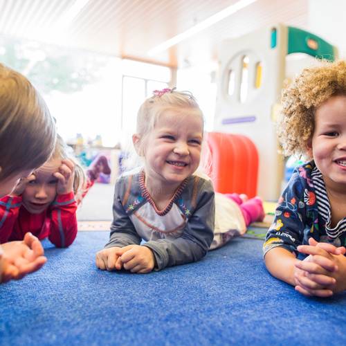 Four young children playing together
