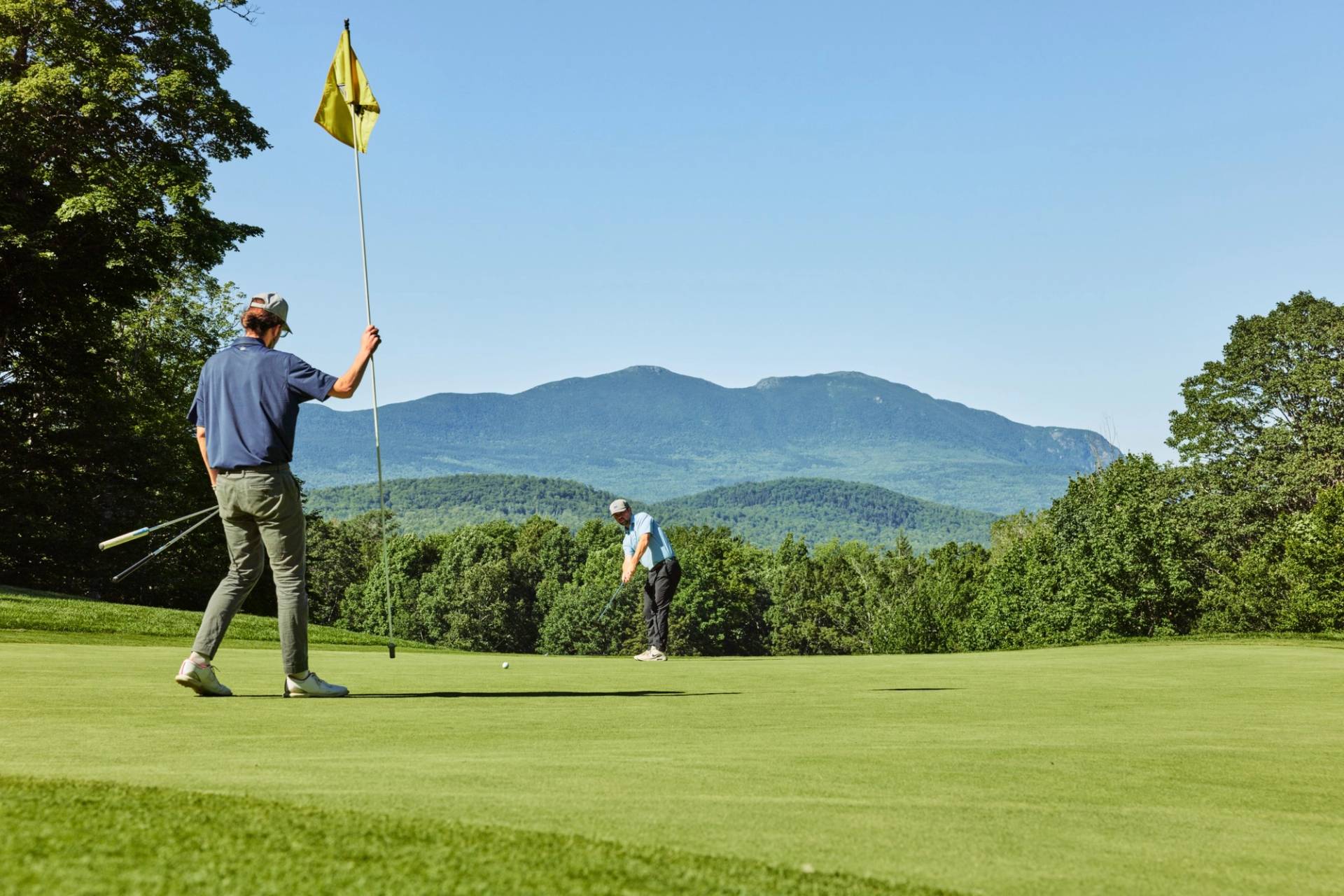 Golfer holding a flag