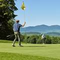 Golfers with mountain views
