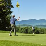 Golfers with mountain views