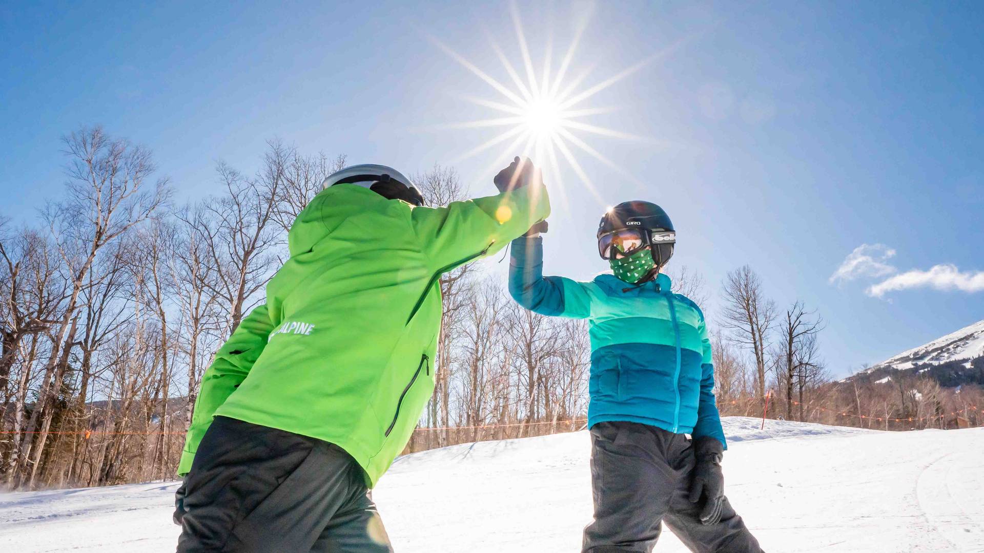 Horizons ski instructor high fiving
